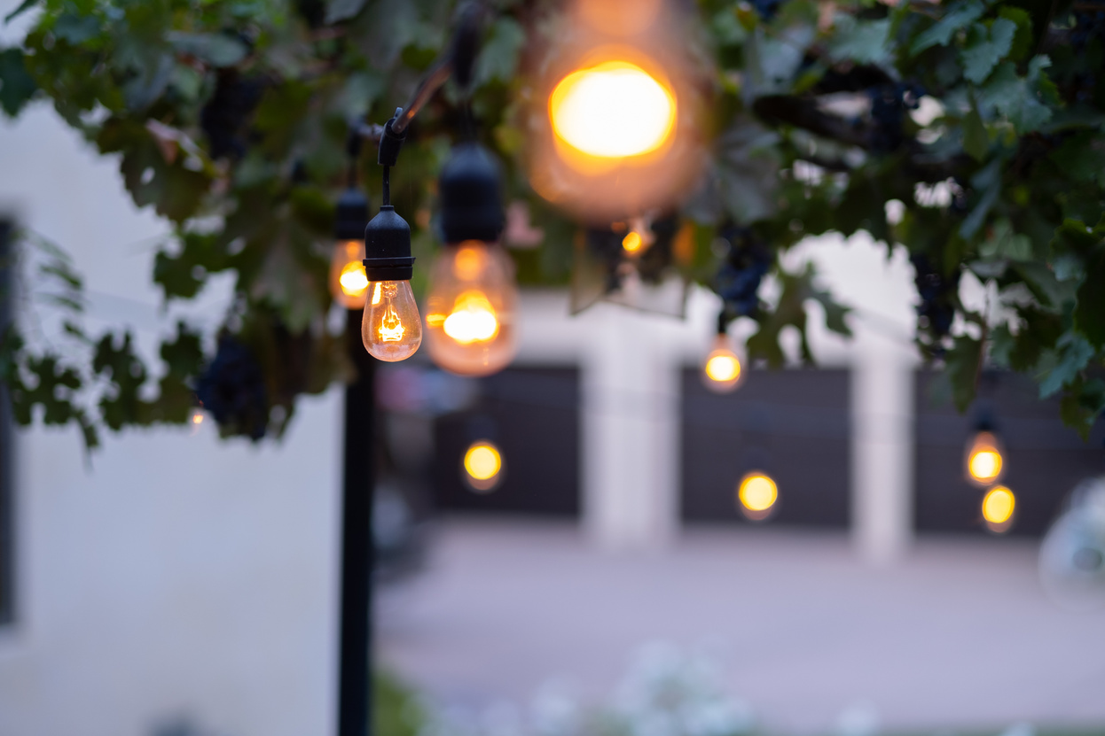 Hanging Outdoor Lights Over Patio With Copy Space